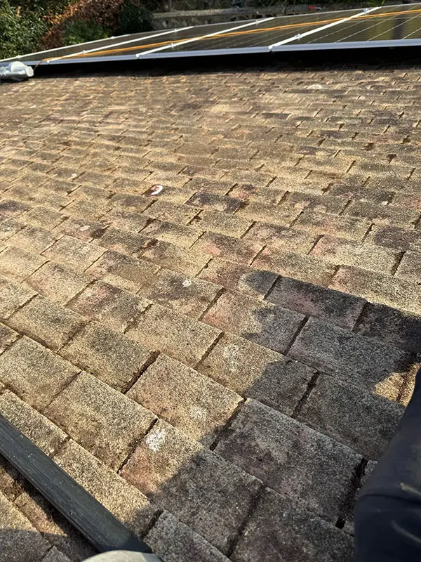 Photograph of a roof being pressure washed clean by Rickard Cleaning Services, Tywyn