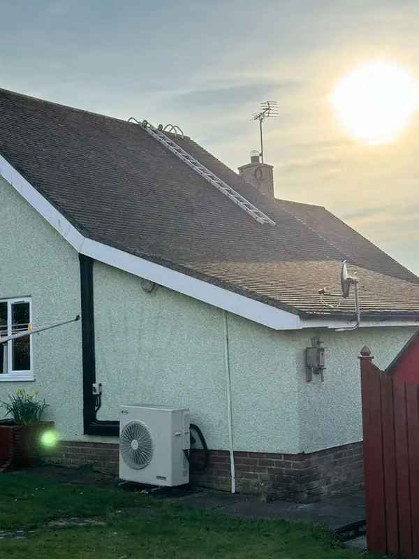 Photograph of a roof being pressure washed clean by Rickard Cleaning Services, Tywyn