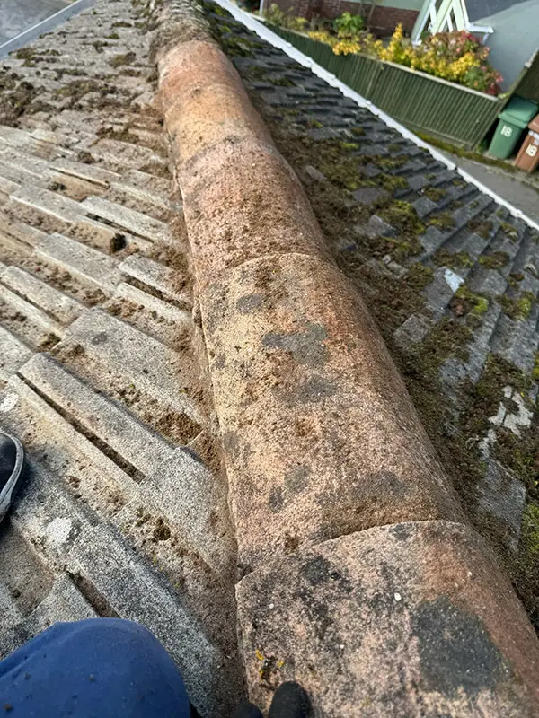 Photograph of a roof being pressure washed clean by Rickard Cleaning Services, Tywyn