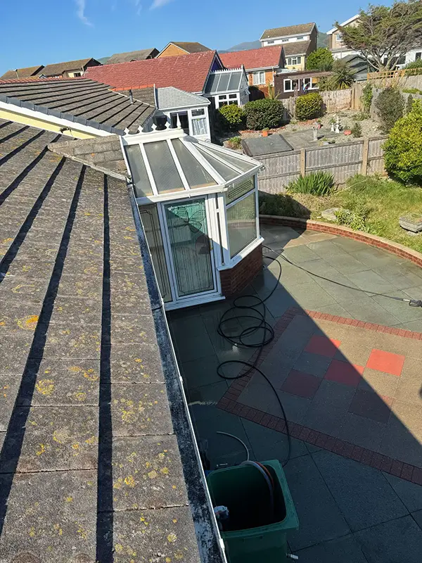 Rickard Cleaning Services pressure washing a Gutter or fascia