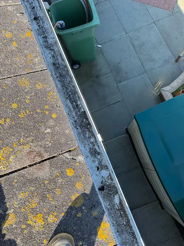 Rickard Cleaning Services pressure washing a Gutter or fascia